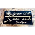 Beautiful Black and Golden Acrylic Bansuri Design Home Name Plate